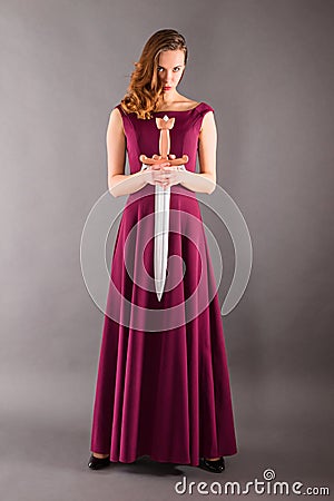 Beautiful young pure princess girl with a sword Stock Photo