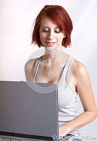 Beautiful young redhead woman sitting Stock Photo