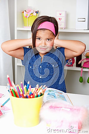 Beautiful young school girl refuse to hear something Stock Photo