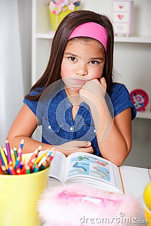 Beautiful young school girl is sick of learning Stock Photo
