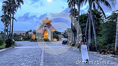 Beautiful sexy young attractive tourist enjoying the moon while walking to a hotel Editorial Stock Photo