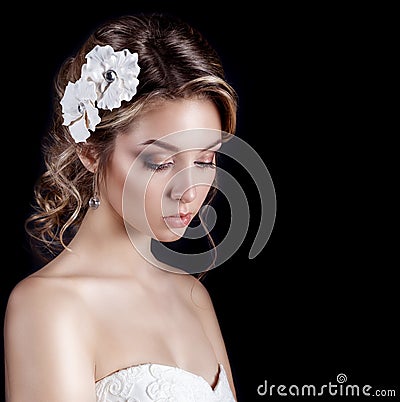 Beautiful young elegant happy smiling woman with red lips, beautiful stylish hairstyle with white flowers in her hair Stock Photo