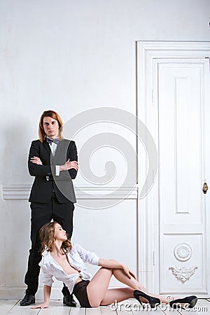 Beautiful young smiling couple in love embracing indoor. Beauty and Fashion. Stock Photo