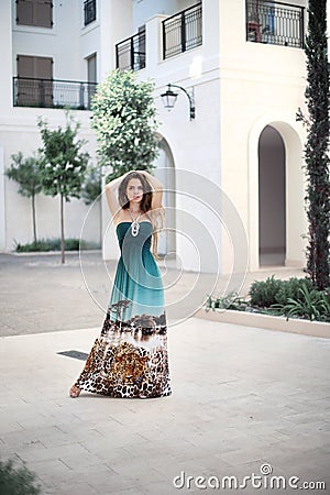 Beautiful young smiling girl with long fashion dress in the mari Stock Photo