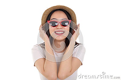 Beautiful young south east Asian woman wearing red frame sunglass eyewear hat pose fashion style white background look around copy Stock Photo