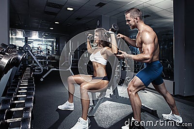 Beautiful young sporty couple in gym Stock Photo