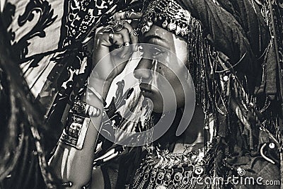 Beautiful young stylish tribal dancer. Woman in oriental costume Stock Photo