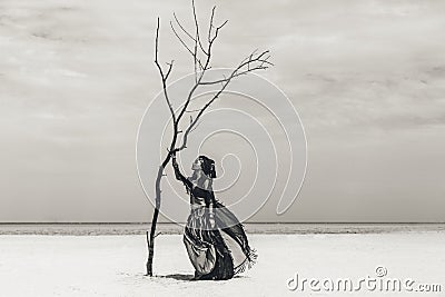 Beautiful young stylish tribal dancer. Woman in oriental costume dancing outdoors Stock Photo