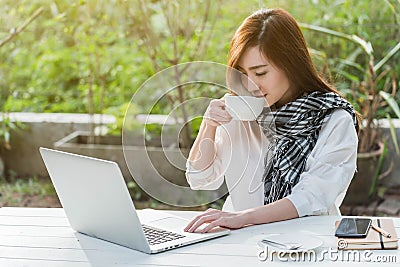 Beautiful young teenage woman freelance work with laptop with a Stock Photo
