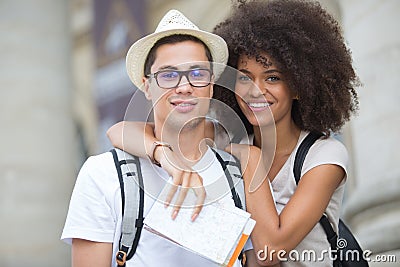 Beautiful young tourist couple posing in city Stock Photo