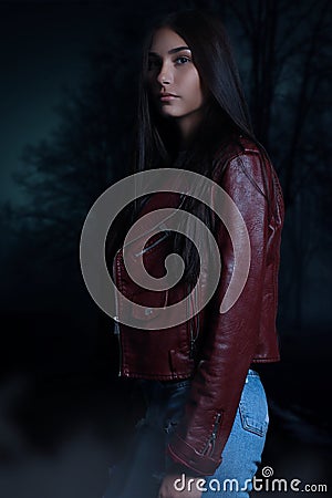 Beautiful young vampire woman on a dark vampire Stock Photo