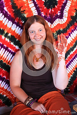 Beautiful young white girl on the background of the mandala shows a hand with a pattern of henna Stock Photo