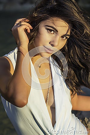 Beautiful young woman, bathed in summer sun Stock Photo