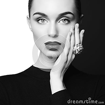 Beautiful young woman with big ring pose in studio Stock Photo