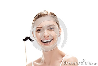 Beautiful young woman with black mustaches on stick Stock Photo