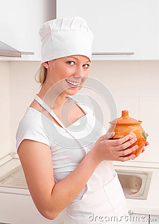 Beautiful young woman with a clay pot Stock Photo