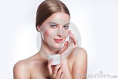 Beautiful Young Woman with Clean Fresh Skin touch own face . Facial treatment . Cosmetology , beauty and spa . Stock Photo