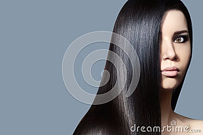 Beautiful young Woman with Clean Skin, Beautiful Straight Shiny Hair, Fashion Makeup. Beautiful Smooth Hairstyle Stock Photo