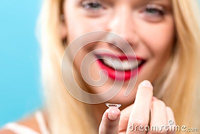 Beautiful young woman with contact lens Stock Photo