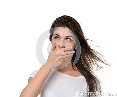 Beautiful young woman covering her mouth with hand Stock Photo