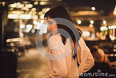 Beautiful young woman dancing alone in the bar at night party. Stock Photo