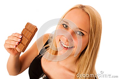 Beautiful young woman eats chocolate isolated over white background Stock Photo