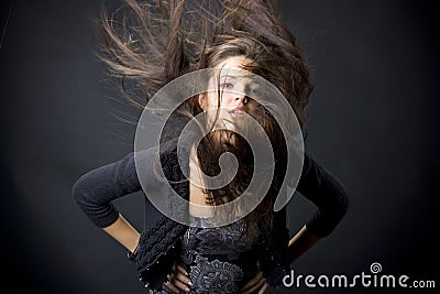 Beautiful young woman with flying hair Stock Photo