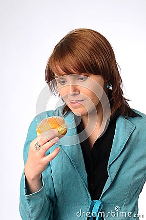 The beautiful young woman with friedcake Stock Photo