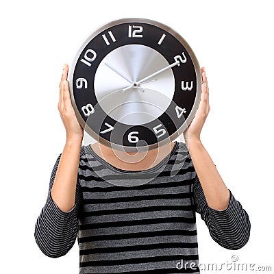 Beautiful young woman holding clock Stock Photo