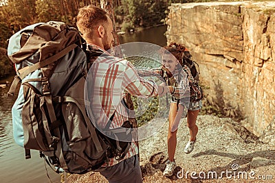Beautiful young woman holding her boyfriends hand Stock Photo