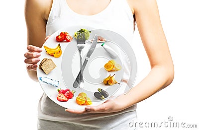 Beautiful young woman holding a plate with food, diet concept Stock Photo