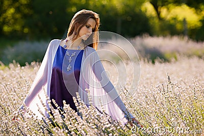 Beautiful young woman on lavander field - lavanda girl Stock Photo