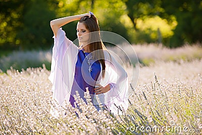 Beautiful young woman on lavander field - lavanda girl Stock Photo