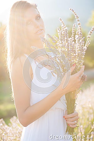 Beautiful young woman on lavander field - lavanda girl Stock Photo