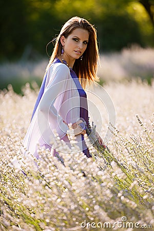 Beautiful young woman on lavander field - lavanda girl Stock Photo