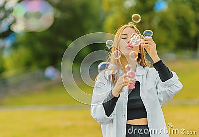 Beautiful young woman on lawn Editorial Stock Photo