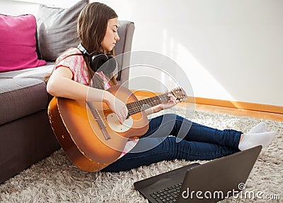 Woman learn playing classical guitar Stock Photo