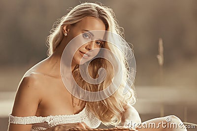 Portrait of beautiful young woman with long blond hair Stock Photo