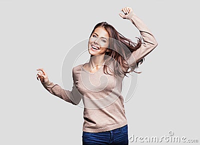 Beautiful girl with long hair laughing, dancing and enjoying life Stock Photo