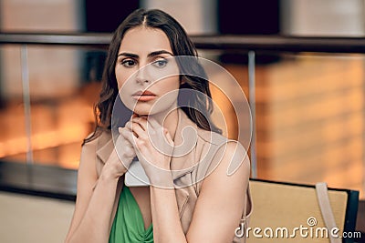 Beautiful young woman looking waiting and looking worried Stock Photo