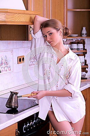 Beautiful young woman make coffee Stock Photo