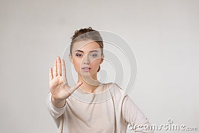 Beautiful young woman making stop gesture Stock Photo