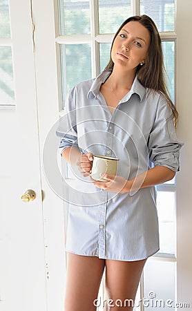 https://thumbs.dreamstime.com/x/beautiful-young-woman-men-s-shirt-coffee-cup-sexy-brunette-wearing-stands-bright-early-morning-light-holding-58193951.jpg