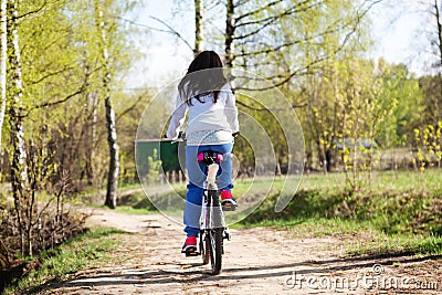 Beautiful young woman with mountain bicycle Stock Photo