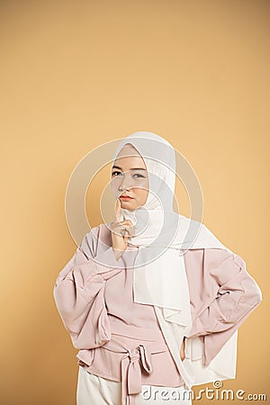 woman muslim asian woman thinking dressed in the hijab modern style Stock Photo
