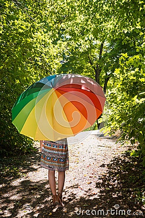 Beautiful young woman with parasol Stock Photo