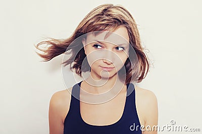 Beautiful young woman with a playful look Stock Photo