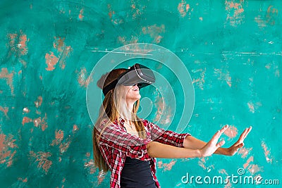 Beautiful young woman playing game in virtual reality glasses Stock Photo