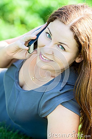 Beautiful young woman portrait speaking on phone Stock Photo