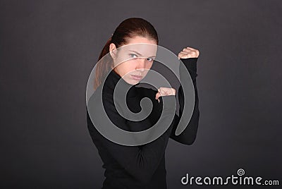 Beautiful young woman ready to fight Stock Photo